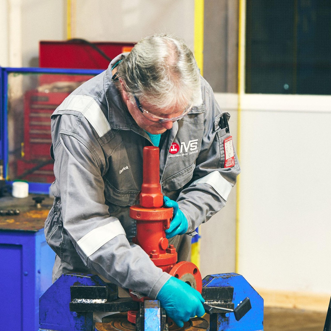 Our Approach - Build - Experienced technician repairing equipment using specialised tools in a workshop setting